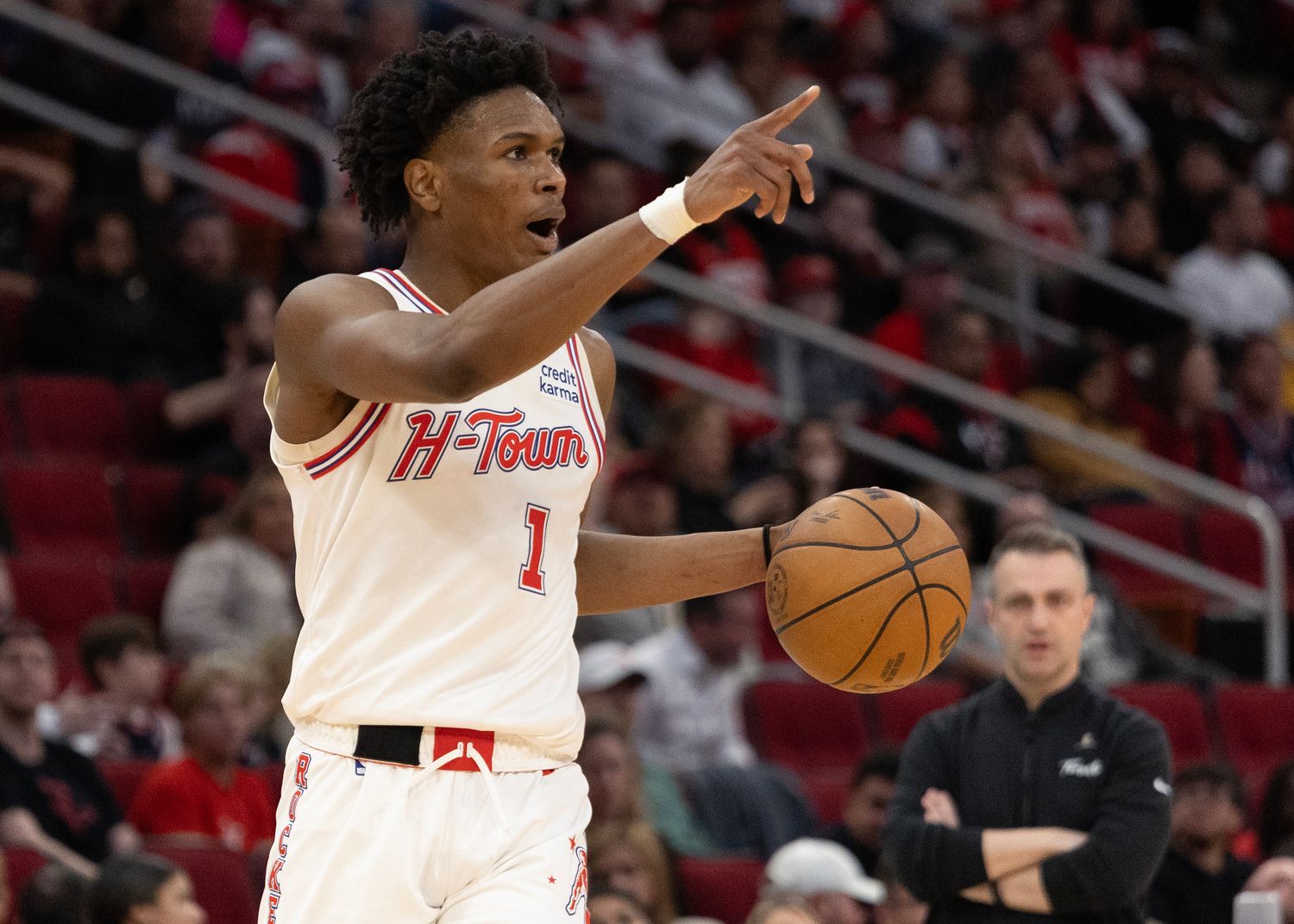 Rockets forward Amen Thompson (1) reacts while dribbling against the Toronto Raptors in the fourth quarter at Toyota Center.
